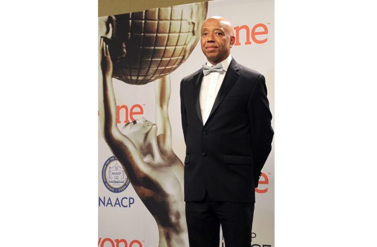 Hip hop magnate Russell Simmons poses backstage at the 46th NAACP Image Awards in Pasadena