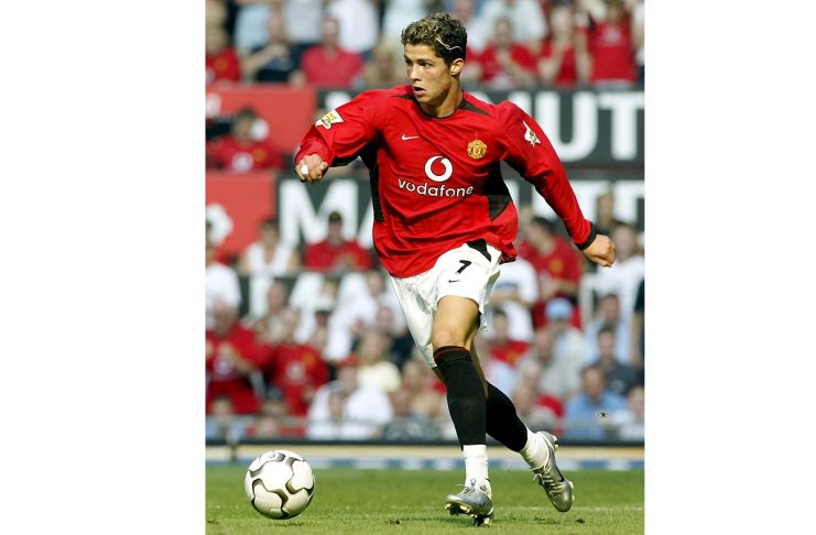 MANCHESTER UNITED’S RONALDO CONTROLS THE BALL AGAINST BOLTON WANDERERS
AT OLD TRAFFORD.