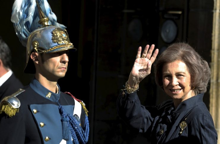 Spain’s Queen Sofia waves upon her arrival at the Reconquista Hotel in Oviedo