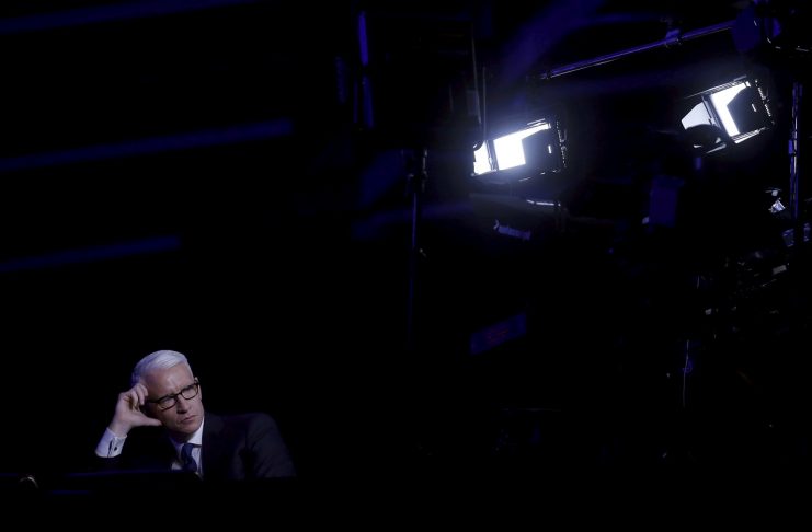 CNN anchor Cooper watches the Democratic U.S. presidential candidates debate between Clinton and Sanders hosted by Univision News and the Washington Post and co-broadcast with CNN in Kendall