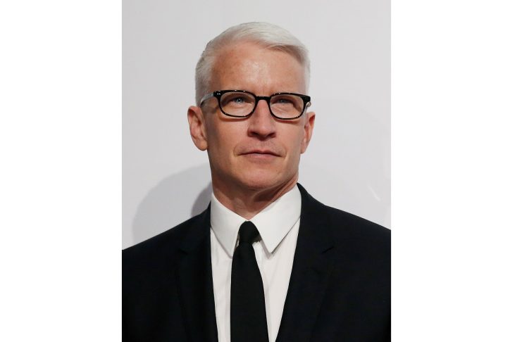 Anderson Cooper poses on the red carpet at the Billboard Magazine’s 11th annual Women in Music luncheon in New York