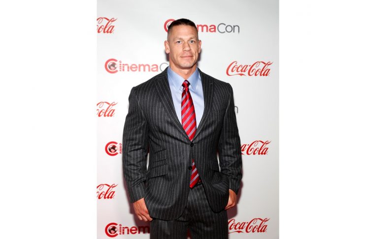 John Cena, recipient of the Action Star of the Year Award, poses on the red carpet during CinemaCon, a convention of movie theater owners, in Las Vegas