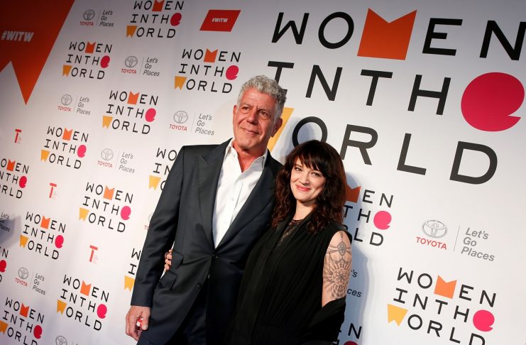 Anthony Bourdain poses with Italian actor and director Asia Argento for the Women In The World Summit in New York