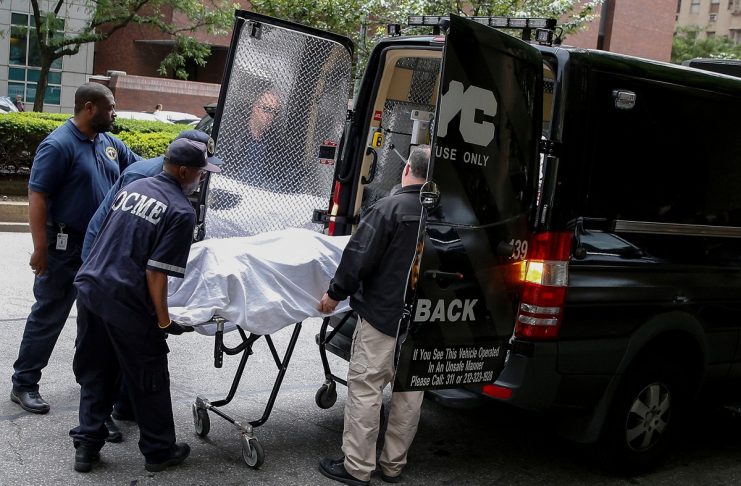 Medical examiners remove the body from the Park Avenue apartment of designer Kate Spade in New York