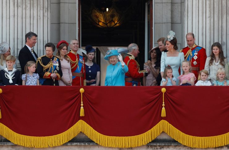 Britain’s Queen Elizabeth, Prince Charles, Prince Harry and Meghan, Duchess of Sussex, Prince William, Catherine, Duchess of Cambridge, along with other members of the British royal family, wave from the balcony of Buckingham Palace as part of Trooping the