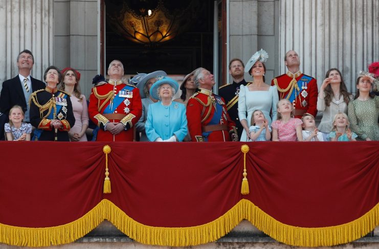 Britain’s Queen Elizabeth, along with other members of the British royal family, look up at the RAF flypast from the balcony of Buckingham Palace as part of Trooping the Colour parade in central London