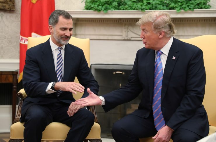 Spain’s King Felipe VI reaches out to shake hands with U.S. President Trump in the Oval Office at the White House in Washington