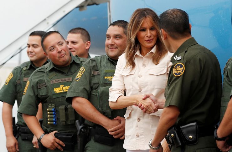 U.S. first lady Melania Trump poses with Border Patrol officers at airport as she departs U.S.-Mexico border area in McAllen, Texas