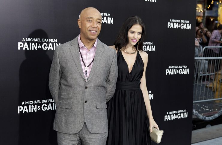 Russell Simmons, co-founder of Def Jam records poses with his girlfriend German model Hana Nitsche at the premiere of the new film “Pain & Gain” directed by Michael Bay in Hollywoodd