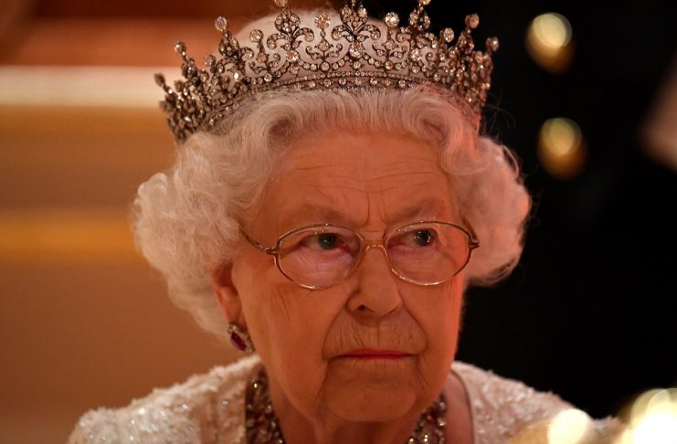 Britain’s Queen Elizabeth listens during speeches at The Queen’s Dinner during the Commonwealth Heads of Government Meeting at Buckingham Palace in London, Britain