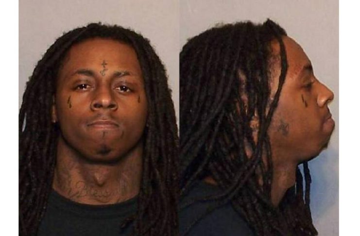 Rap music artist Lil Wayne is shown in a police booking photo after being arrested for felony drug possession