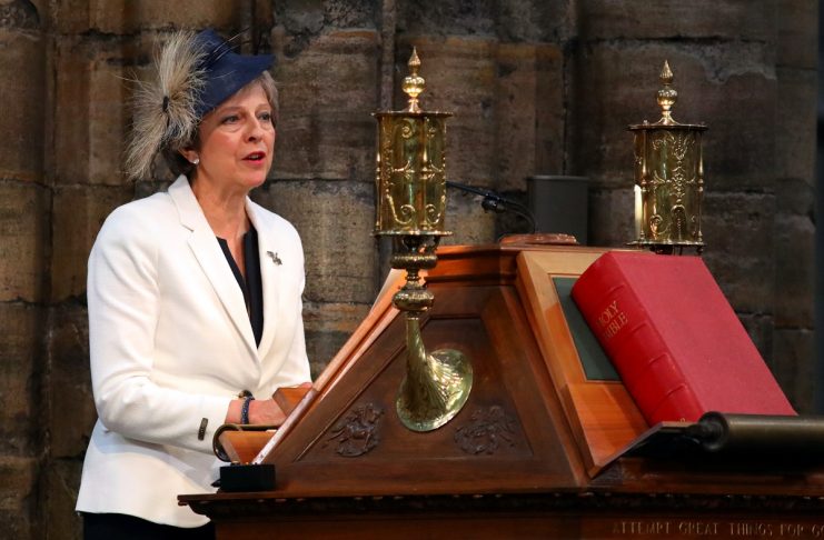 Britain’s Prime Minister, Theresa May, speaks at Westminster Abbey for a service to mark the centenary of the Royal Air Force, in central London