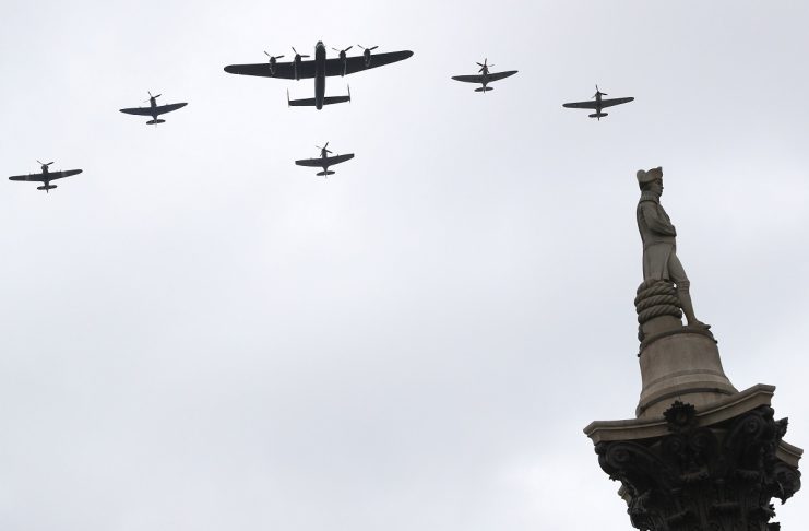 Vintage military aircraft perform a fly past over Trafalgar Square to mark the centenary of the Royal Air Force in central London