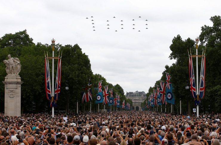 Military aircraft perform a fly past over the Mall and Buckingham Palace to mark the centenary of the Royal Air Force in central London