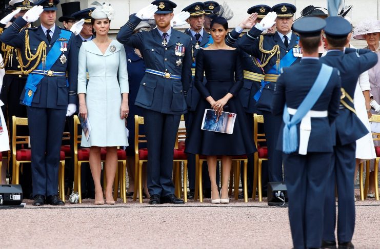 Britain’s Prince William, Catherine, Duchess of Cambridge, Prince Harry and Meghan, Duchess of Sussex join RAF personell in the grounds of Buckingham Palace for a fly past to mark the centenary of the Royal Air Force in central London