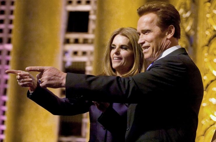 California Gov. Arnold Schwarzenegger points to friends with first lady Maria Shriver at inauguration in Sacramento