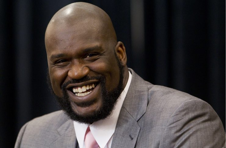 Shaquille O’Neal laughs as he announces his retirement from NBA at a news conference in Windermere