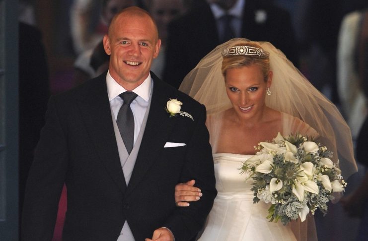 Britain’s Zara Phillips and her husband England rugby captain Mike Tindall leave the church after their marriage at Canongate Kirk in Edinburgh