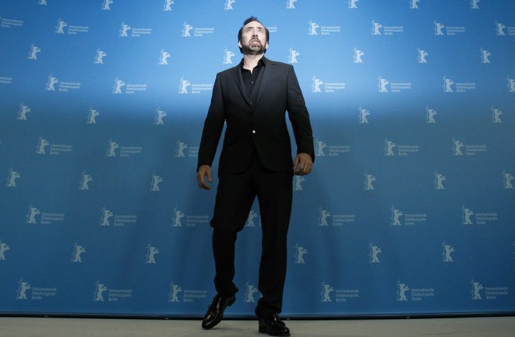 Actor Cage poses during photocall to promote animation movie “The Croods” at 63rd Berlinale International Film Festival in Berlin