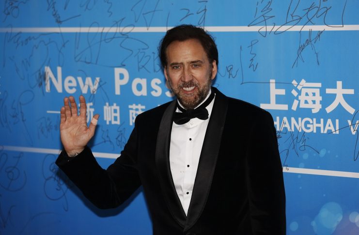 U.S. actor Nicolas Cage poses on the red carpet at the Huading Awards ceremony in Macau