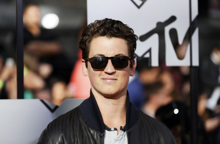 Miles Teller arrives at the 2014 MTV Movie Awards in Los Angeles