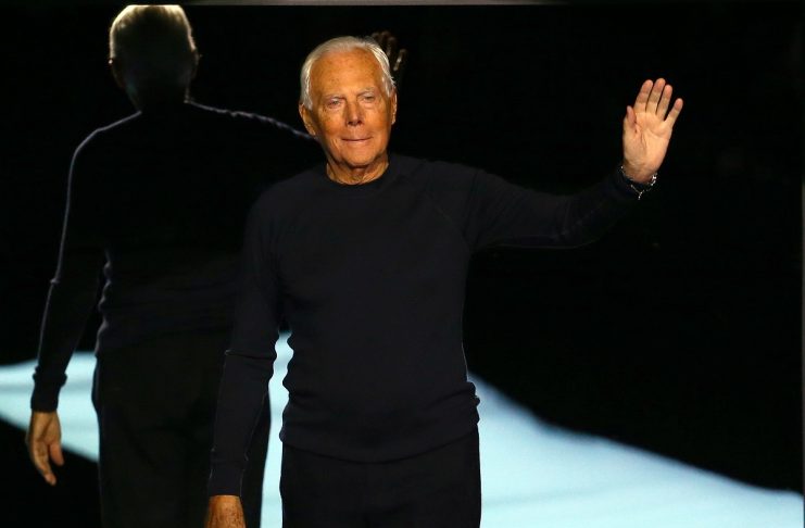 Italian designer Giorgio Armani acknowledges the applause at the end of his Autumn/Winter 2017 women collection during Milan Fashion Week, in Milan