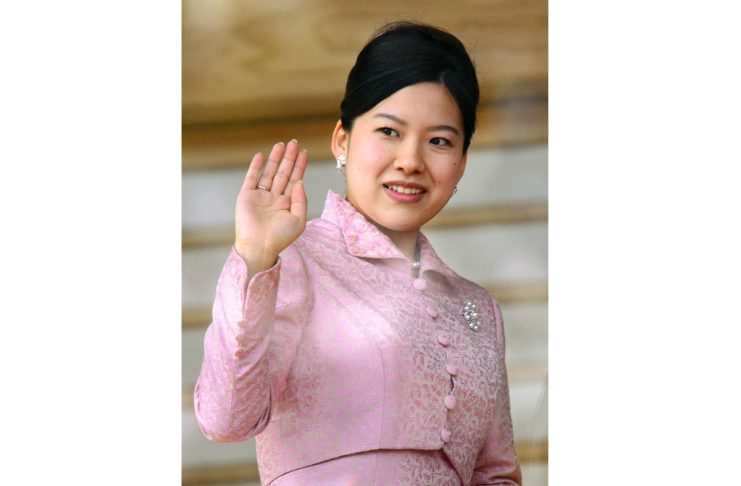 Japan’s Princess Ayako, third daughter of the late Prince Takamado and Princess Hisako waves to well-wishers during a public appearance for New Year celebrations at the Imperial Palace in Tokyo