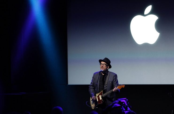 Singer Elvis Costello performs during Apple Inc’s media event in Cupertino