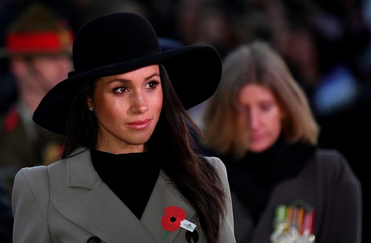 Britain’s Prince Harry and his fiancee Meghan Markle attend the Dawn Service at Wellington Arch to commemorate Anzac Day in London, Britain