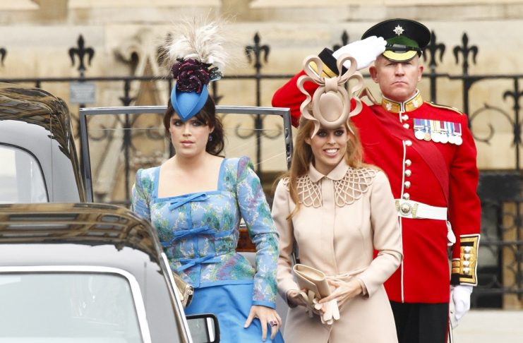 Britain’s Princess Eugenie and Princess Beatrice arrive at Westminster Abbey before the wedding of Britain’s Prince William and Kate Middleton, in central London