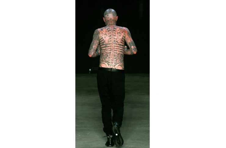 Canadian model Rick Genest presents a creation from Auslander’s collection during Fashion Rio Summer 2012