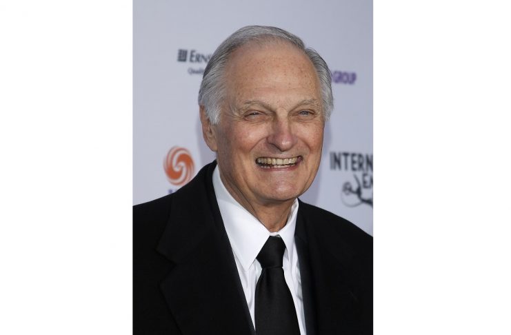 Actor Alan Alda smiles as he arrives for the International Emmy Awards in New York