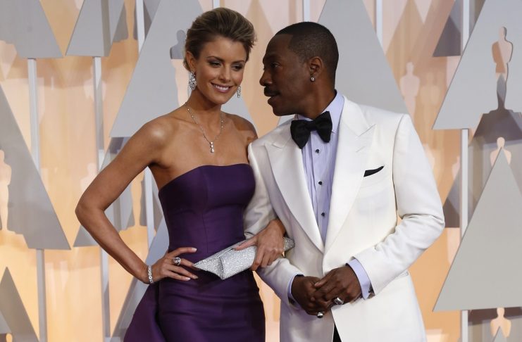 Comedian Eddie Murphy and Paige Butcher arrive at the 87th Academy Awards in Hollywood