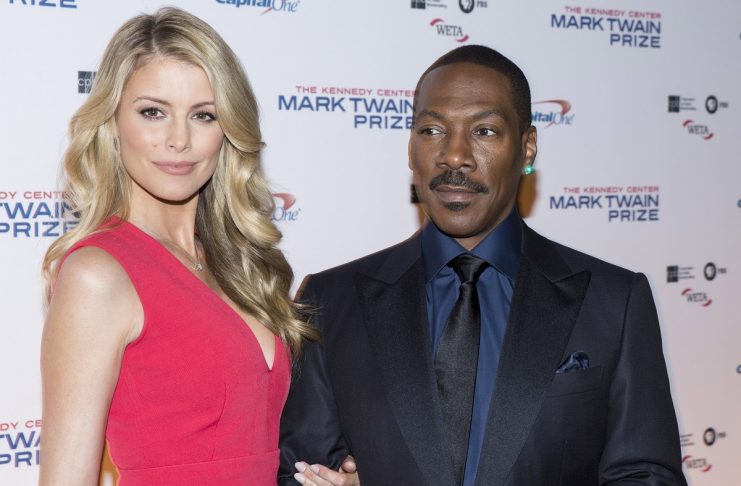 Eddie Murphy and his partner Paige Butcher arrive for the Mark Twain prize for Humor honoring Murphy at the Kennedy Center in Washington