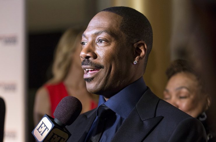 Eddie Murphy speaks to reporters as he arrives for the Mark Twain prize for Humor honoring Murphy at the Kennedy Center in Washington