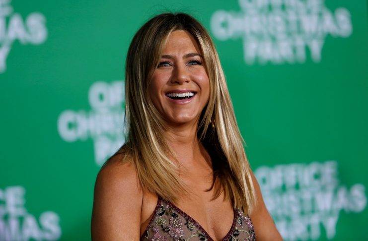 Cast member Aniston poses at the premiere of “Office Christmas Party” in Los Angeles
