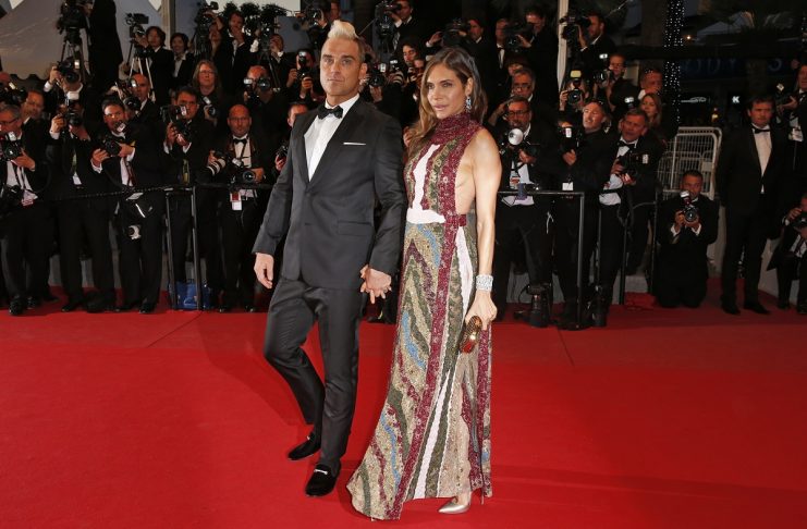 Singer Robbie Williams and his wife Ayda Field pose on the red carpet as they arrive for the screening of the film “The Sea of Trees” in competition at the 68th Cannes Film Festival in Cannes