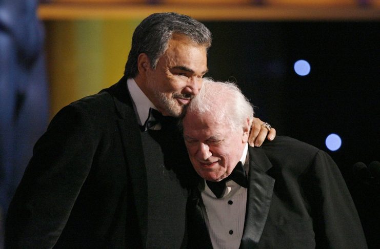 Actor Burt Reynolds hugs Charles Durning after he accepted the Lifetime Achievement award at the 14th annual Screen Actors Guild Awards in Los Angeles