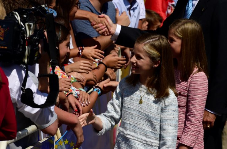 Spain’s Princess Leonor gestures during the performances marking the occasion of the Centenary of the Catholic Coronation of the Virgin of Covadonga outside the Basilica of Covadonga in Cangas de Onis