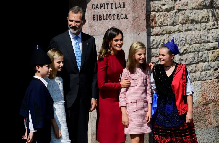 Spain’s Princess Leonor poses with her family including Spain’s King Felipe, Queen Letizia, Princess Sofia and two children wearing traditional costumes outside the Basilica of Covadonga in Cangas de Onis