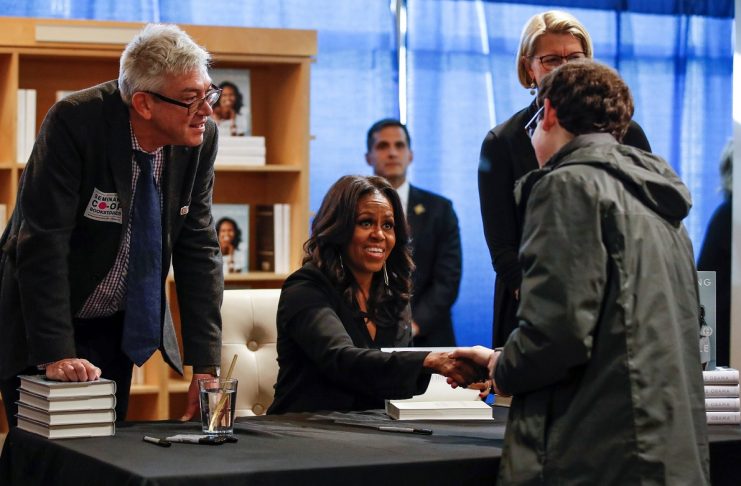 Former first lady Michelle Obama signs copies of her memoir “Becoming” in Chicago