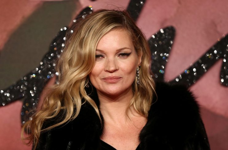 Model Kate Moss poses for photographers at the Fashion Awards 2016 in London