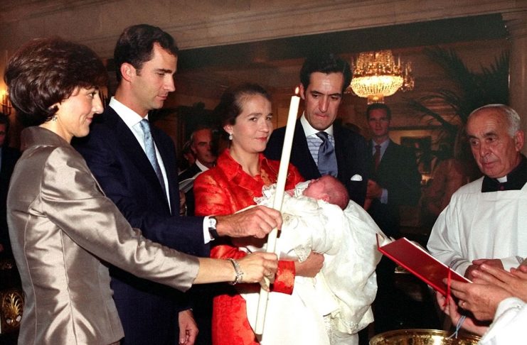 Spain’s Princess Elena (C), second in line to the throne, holds her newborn daughter baby Victoria F..