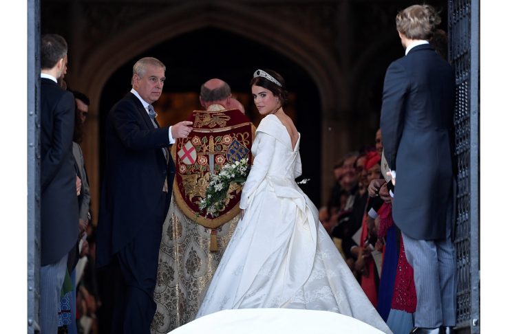 Britain’s Princess Eugenie enters St George’s Chapel with her father Prince Andrew, Duke of York, for her wedding to Jack Brooksbank in Windsor Castle, Windsor