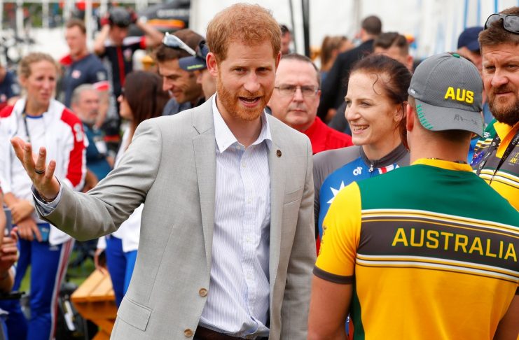 Britain’s Prince Harry talks with athletes during the Invictus Games at the Royal Botanic Garden in Sydney