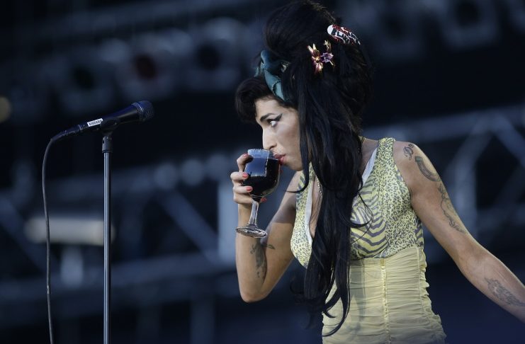 BEST QUALITY AVAILABLE  British singer Amy Winehouse drinks a glass of wine during her performance at the “Rock in Rio” music festival in Arganda del Rey, near Madrid