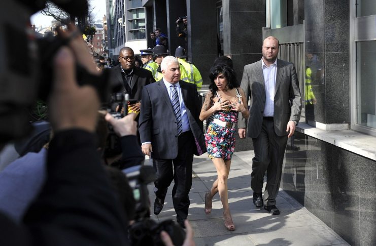 British singer Amy Winehouse arrives at the City of Westminster Magistrates Court in central London