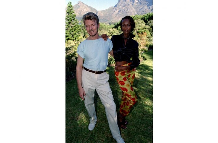 Pop star David Bowie and his super model wife Iman pose for photographies during a visit to Cape Tow..
