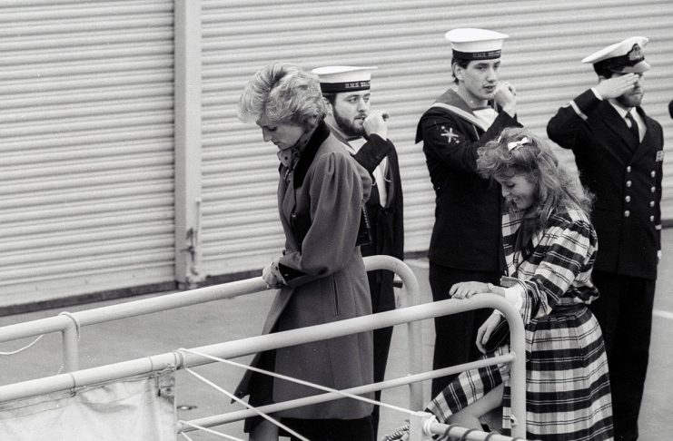 Princess Diana and Sarah Ferguson are piped off HMS Brazen, which is moored in the pool of London