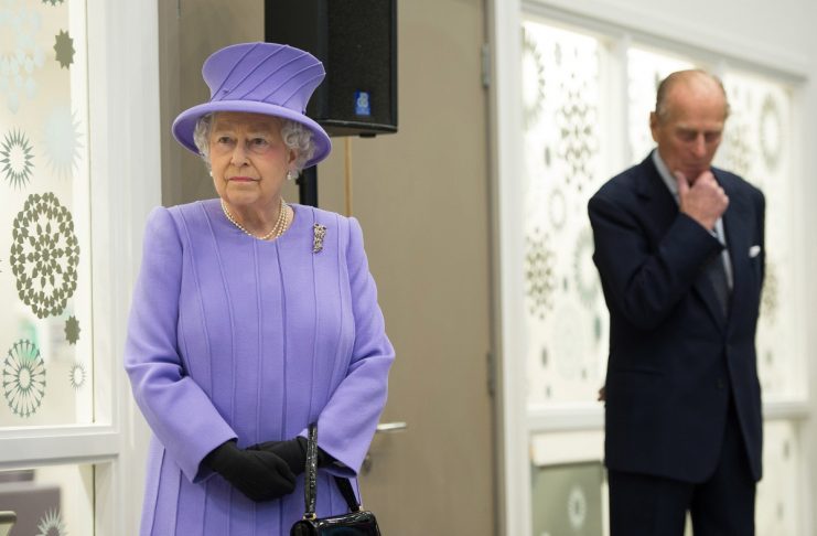 Britain’s Queen Elizabeth and her husband Prince Philip pause during a tour of the Royal London Hospital in east London